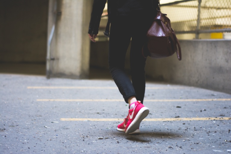 Woman walking in pink Nike trainers